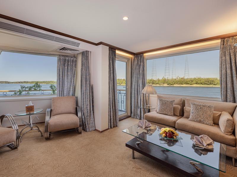 A seating area in a room on the Sonesta Star Goddess Cruise.